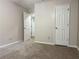 Bedroom with neutral walls, carpet flooring, and two white paneled doors at 1035 Towne Manor Nw Ct, Kennesaw, GA 30144