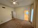 Spacious carpeted bedroom with doors to ensuite bathroom and additional rooms at 1035 Towne Manor Nw Ct, Kennesaw, GA 30144