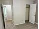 Bedroom featuring neutral walls, carpet flooring, closet, and doorways at 1035 Towne Manor Nw Ct, Kennesaw, GA 30144
