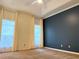 Large primary bedroom with neutral walls and ceiling fan with view to windows at 1035 Towne Manor Nw Ct, Kennesaw, GA 30144