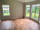 Sun-drenched room with hardwood floors and large windows offering pleasant views at 1035 Towne Manor Nw Ct, Kennesaw, GA 30144