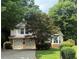 Charming two-story home with a two-car garage and well-manicured landscaping at 1035 Towne Manor Nw Ct, Kennesaw, GA 30144