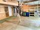 Spacious two-car garage with storage shelves and concrete floors, offering ample space at 1035 Towne Manor Nw Ct, Kennesaw, GA 30144