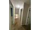 Hallway featuring neutral walls and carpet flooring with doors leading to various rooms at 1035 Towne Manor Nw Ct, Kennesaw, GA 30144