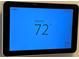 Smart thermostat displaying the current indoor and outdoor temperatures at 1035 Towne Manor Nw Ct, Kennesaw, GA 30144