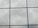 Close up of light beige, square tile flooring with contrasting grout lines at 1035 Towne Manor Nw Ct, Kennesaw, GA 30144