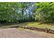 Large and well-maintained backyard with a wooden deck, perfect for outdoor entertaining and relaxation at 1729 Norden Rd, Riverdale, GA 30296