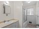 Clean bathroom with vanity, mirror, and shower/tub combo at 1729 Norden Rd, Riverdale, GA 30296
