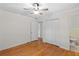 Neutral bedroom with hardwood floors, closet, and adjacent bathroom at 1729 Norden Rd, Riverdale, GA 30296