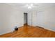 Bright bedroom with hardwood floors, closet, and white trim at 1729 Norden Rd, Riverdale, GA 30296