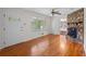 Cozy living room with hardwood floors, ceiling fan, fireplace, and an open layout at 1729 Norden Rd, Riverdale, GA 30296