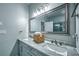 Bright bathroom with double sink vanity, stylish lighting, and framed mirror at 220 Chandler Ct, Sugar Hill, GA 30518