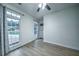 Cozy bedroom featuring bright windows and attractive gray wood flooring at 220 Chandler Ct, Sugar Hill, GA 30518