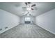 Large bonus room with carpet, a projector screen, recessed lighting, and ceiling fans at 220 Chandler Ct, Sugar Hill, GA 30518