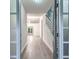 Inviting entryway leading to stairs and an open living area with wood-look flooring at 220 Chandler Ct, Sugar Hill, GA 30518