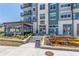 Apartment building with brick and siding exterior, outdoor dining and water feature at 220 Chandler Ct, Sugar Hill, GA 30518