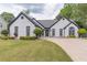 Well-maintained home with lush lawn and attractive landscaping at 220 Chandler Ct, Sugar Hill, GA 30518