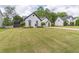 Spacious front yard with lush green grass at 220 Chandler Ct, Sugar Hill, GA 30518