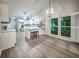 Bright kitchen with large island, modern appliances, and dining area at 220 Chandler Ct, Sugar Hill, GA 30518