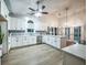 Bright kitchen features white cabinets, stainless steel appliances, and hardwood floors at 220 Chandler Ct, Sugar Hill, GA 30518