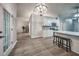 Open concept kitchen with island, laminate flooring, and stylish appliances at 220 Chandler Ct, Sugar Hill, GA 30518