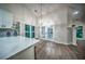 Bright kitchen featuring island, dining area, and modern finishes at 220 Chandler Ct, Sugar Hill, GA 30518