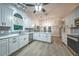Beautiful kitchen with modern stainless steel appliances, and island at 220 Chandler Ct, Sugar Hill, GA 30518