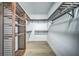Spacious walk-in closet with custom wood shelving and laminate floor at 220 Chandler Ct, Sugar Hill, GA 30518