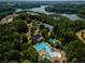 Aerial view of community amenities, including pool, tennis courts, and lake access at 338 Boundless Ln, Canton, GA 30114