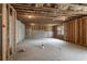 Spacious unfinished basement, with framed walls, exposed ceiling, and open layout at 338 Boundless Ln, Canton, GA 30114