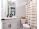 A well-lit bathroom with a vanity, toilet, and shower-tub combination at 338 Boundless Ln, Canton, GA 30114