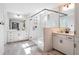 Modern bathroom featuring double vanity, glass enclosed shower, and sleek fixtures at 338 Boundless Ln, Canton, GA 30114