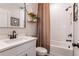 Stylish bathroom with a white vanity, subway tile shower, and modern fixtures at 338 Boundless Ln, Canton, GA 30114
