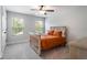 Light bedroom features a wooden bed frame, natural light, and neutral decor at 338 Boundless Ln, Canton, GA 30114