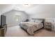 Cozy bedroom with a comfortable bed, accent furniture, and a window at 338 Boundless Ln, Canton, GA 30114