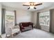 Cozy bedroom featuring a dark wood crib, neutral tones, and large windows at 338 Boundless Ln, Canton, GA 30114