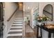 Inviting entryway featuring hardwood floors, staircase, and stylish decor, creating a warm welcome at 338 Boundless Ln, Canton, GA 30114