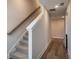 Staircase with carpet steps and hardwood flooring in the hallway at 338 Boundless Ln, Canton, GA 30114