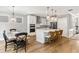 Open kitchen and dining area with hardwood floors, stainless steel appliances, and island with seating at 338 Boundless Ln, Canton, GA 30114