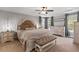 Serene main bedroom featuring a tray ceiling, neutral tones, and coordinated furniture at 338 Boundless Ln, Canton, GA 30114