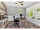 Well-lit office space with built-in shelving and a large desk, perfect for remote work and productivity at 338 Boundless Ln, Canton, GA 30114