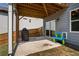 Cozy covered patio with a grill and outdoor toys, perfect for entertaining at 338 Boundless Ln, Canton, GA 30114