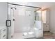 Newly renovated shower featuring a shower bench, rainfall shower head, and glass enclosure at 338 Boundless Ln, Canton, GA 30114