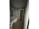 Bathroom featuring an extended vanity with ample storage and a door to the bathtub/shower combo at 6192 Meadowbrook Dr, Norcross, GA 30093