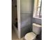 This bathroom features a standard toilet with a combination tub and shower at 6192 Meadowbrook Dr, Norcross, GA 30093