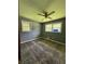 Bedroom with patterned carpeting, a window overlooking greenery, and light-grey walls at 6192 Meadowbrook Dr, Norcross, GA 30093