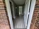 Inviting entryway features stylish gray wood-look flooring and crisp white trim, offering a bright and modern feel at 6192 Meadowbrook Dr, Norcross, GA 30093