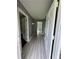 Inviting entryway features stylish gray wood-look flooring and crisp white trim, offering a bright and modern feel at 6192 Meadowbrook Dr, Norcross, GA 30093