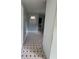 Hallway featuring vintage tile flooring and light blue paint at 6192 Meadowbrook Dr, Norcross, GA 30093