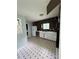 Functional kitchen with white cabinets, modern appliances, and tile floors at 6192 Meadowbrook Dr, Norcross, GA 30093
